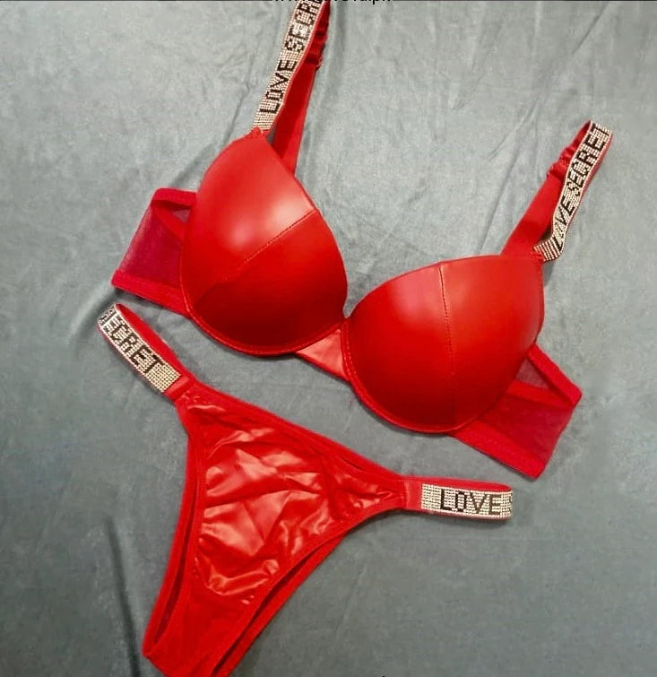 Red lingerie set with 'Love Secret' branding on a gray background