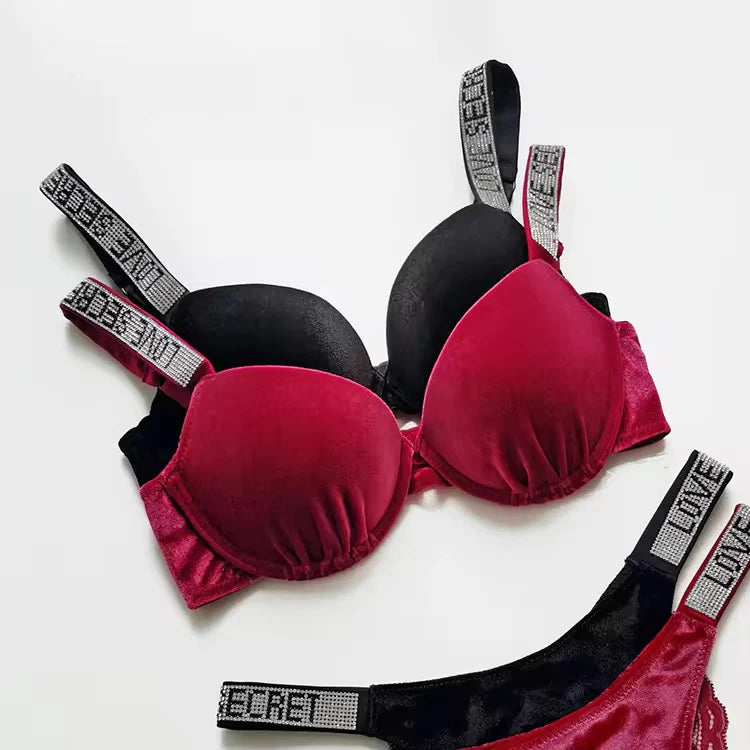 Red and black bra with 'Secret' label on a white background