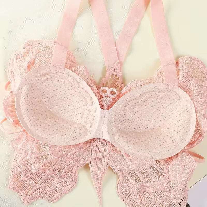 Pink lace bra on a light background