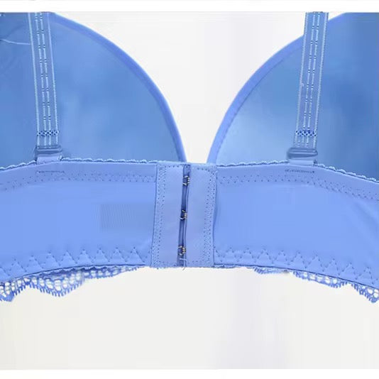 Blue bra with lace trim on a white background