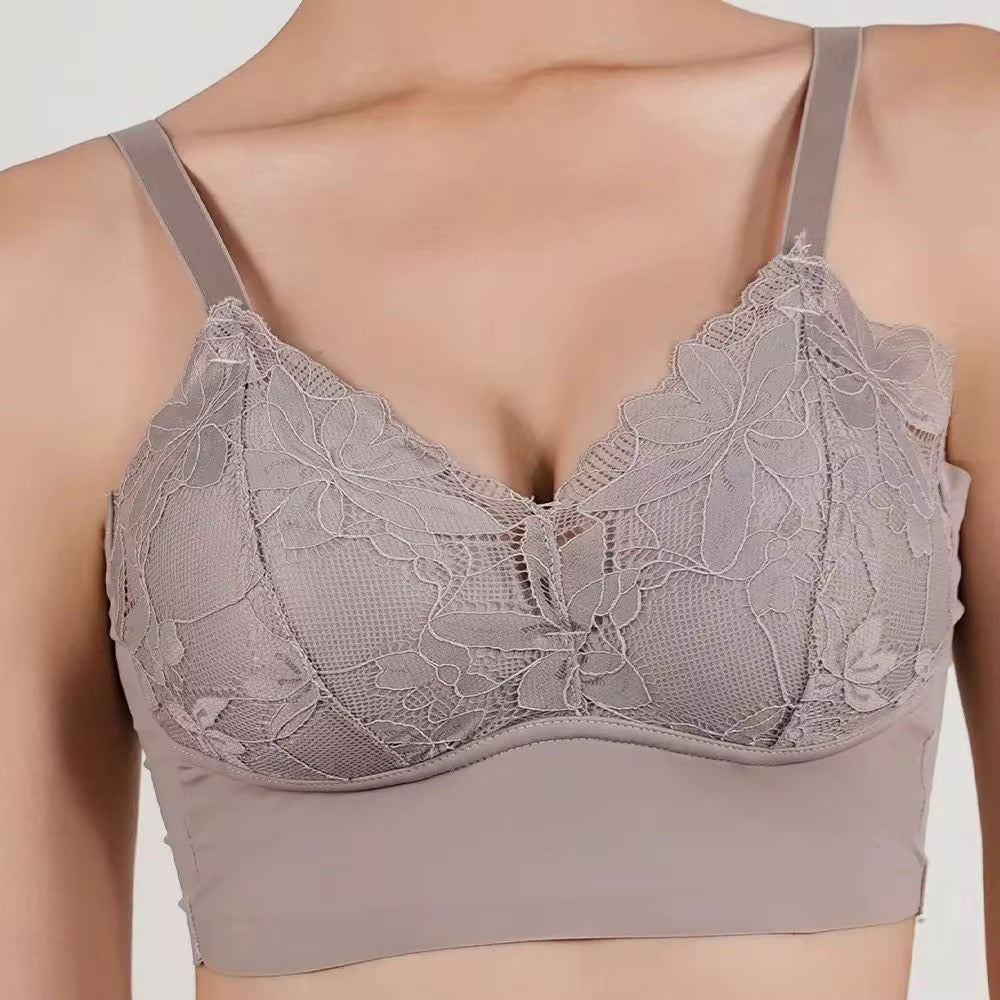 Lace bralette worn by a model on a plain background