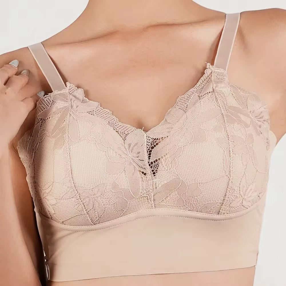 Beige lace bra on a plain background