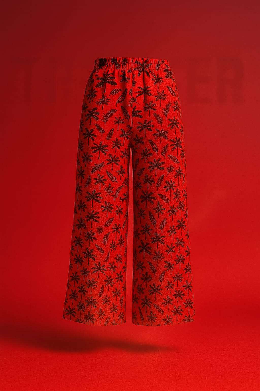 Red pants with black floral pattern on a red background