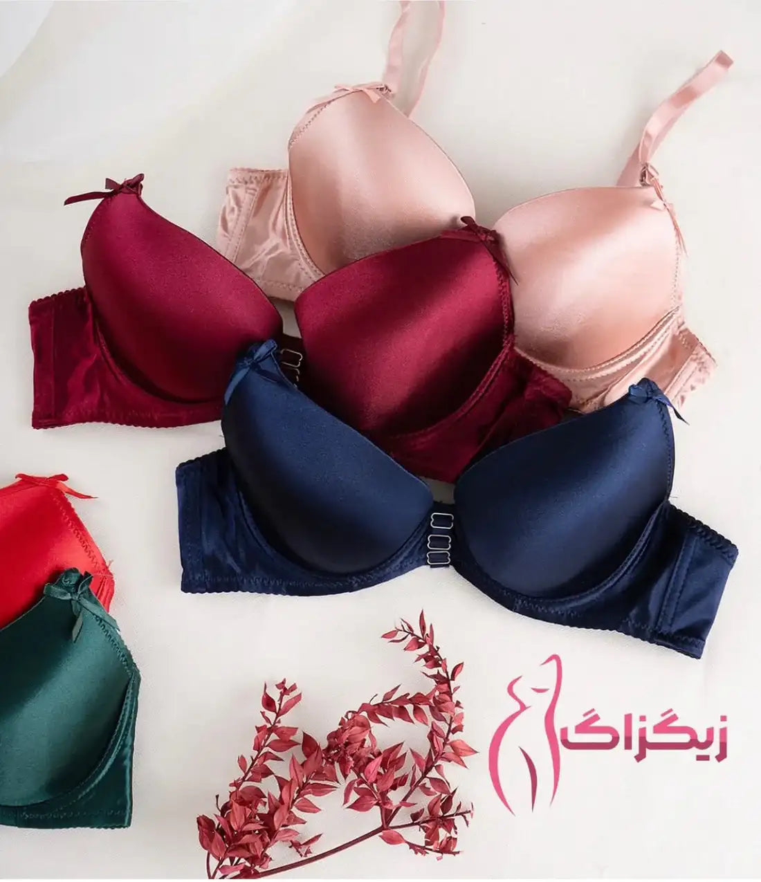 Collection of colorful bras on a white background with a brand logo.