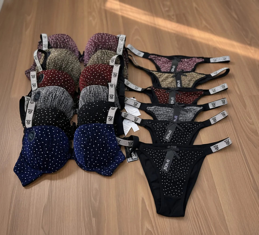 Assorted women's lingerie on a wooden surface