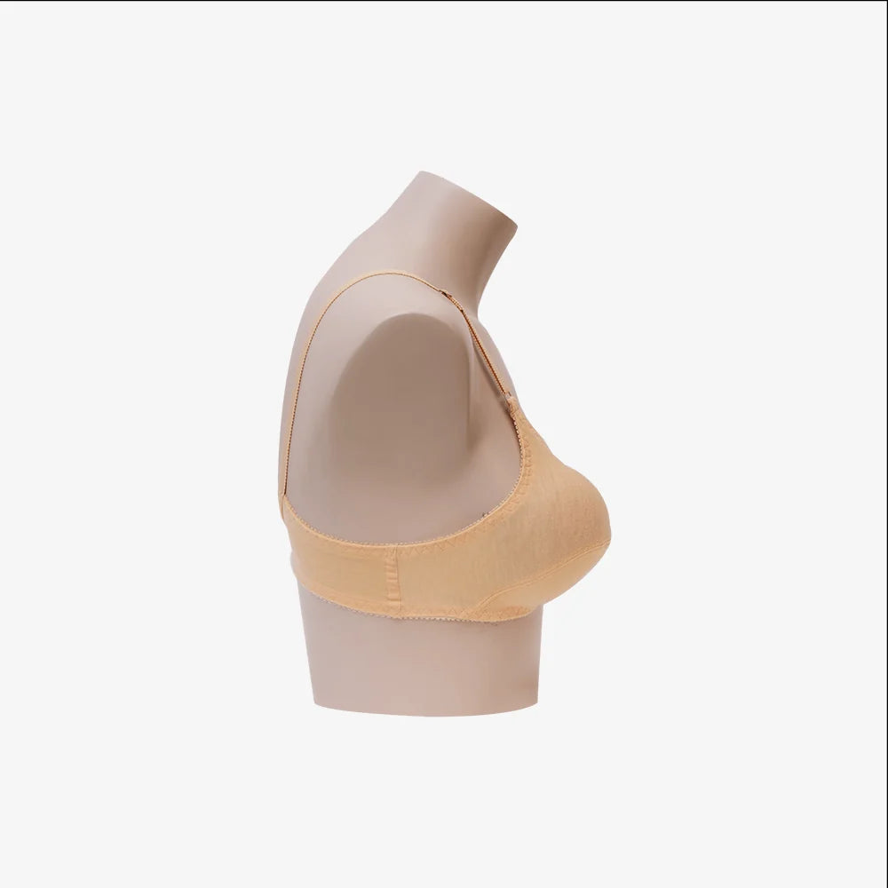 Beige bra on a mannequin bust against a white background