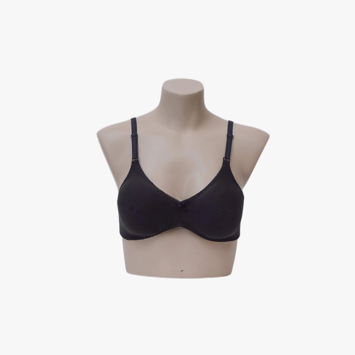 Black bra on a mannequin against a white background