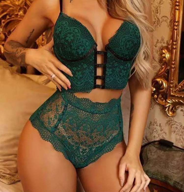 Person wearing a green lace lingerie set in an ornate room.