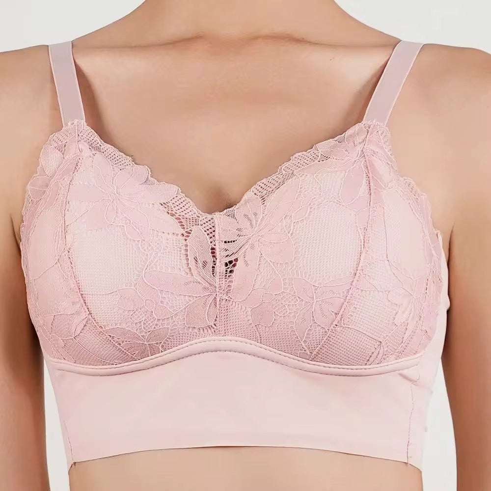 Pink lace bra on a plain background