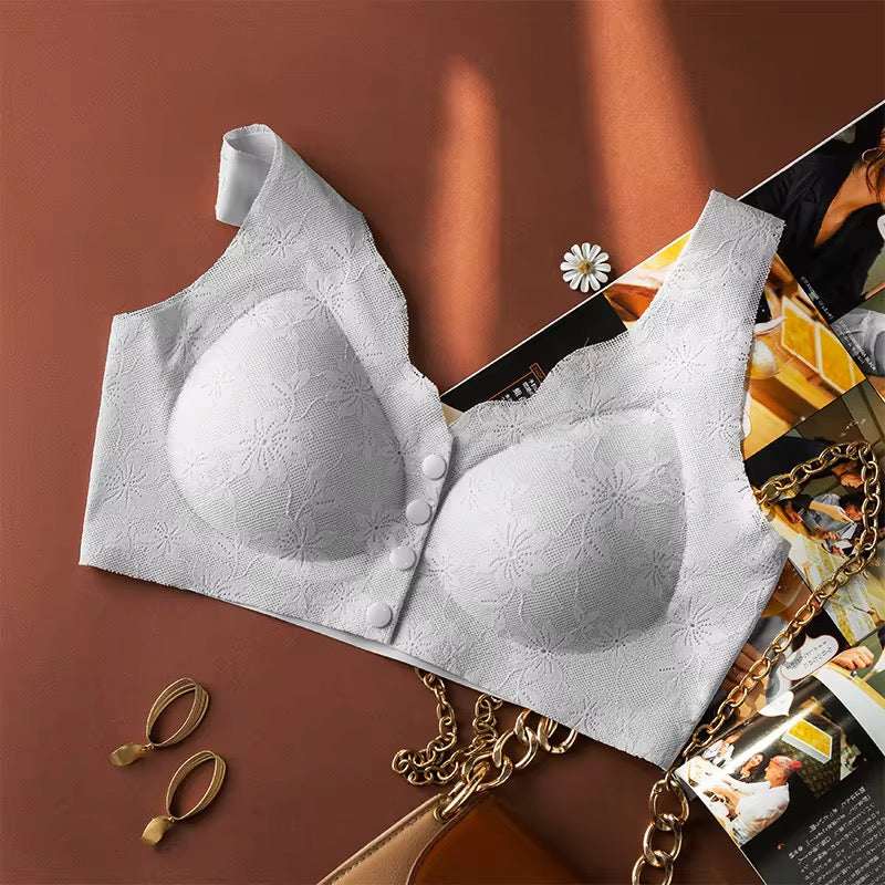White bra with floral patterns on a magazine and gold chain background
