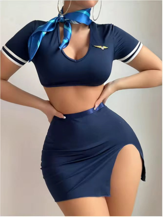 Navy blue outfit with a matching skirt and top, featuring a brand logo on the top.