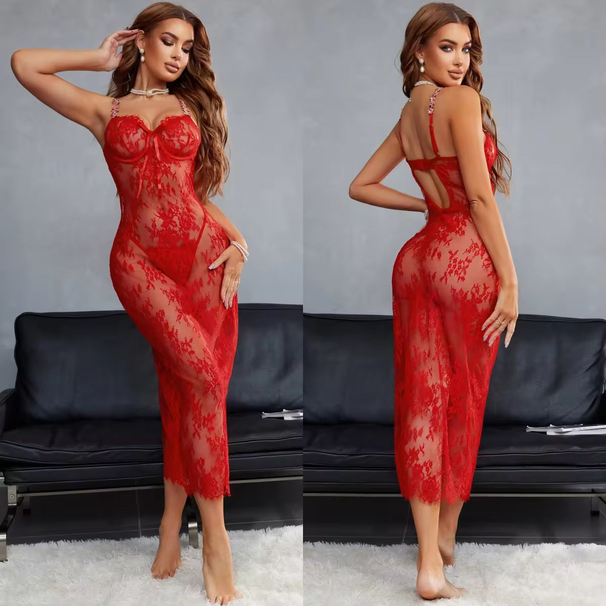 Woman wearing a red lace lingerie set in a room with a black sofa.