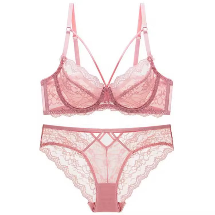 Pink lace lingerie set on a white background