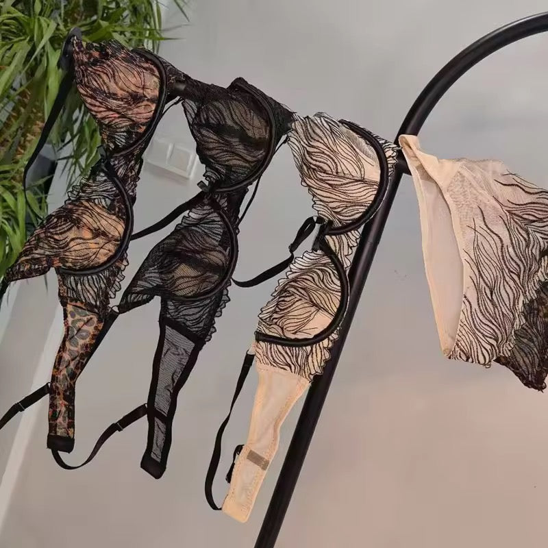 Lingerie set hanging on a rack with a neutral background