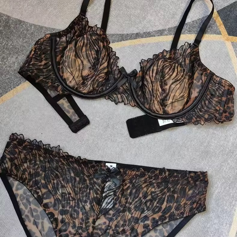 Leopard print lingerie set on a textured surface