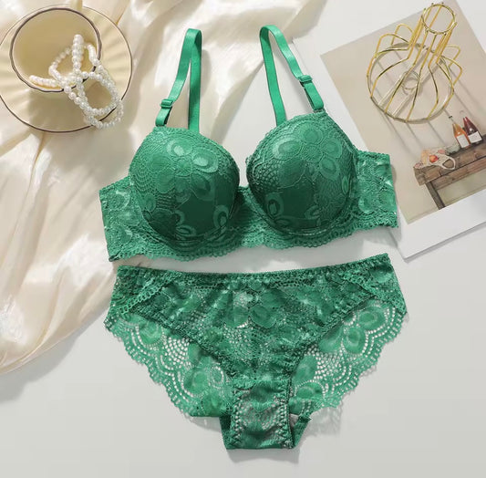 Green lace lingerie set on a light background