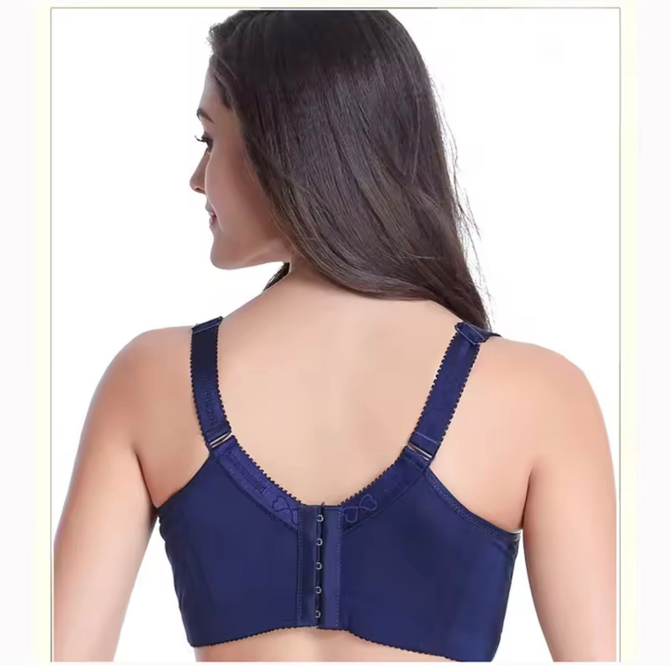 Woman wearing a blue bra on a white background
