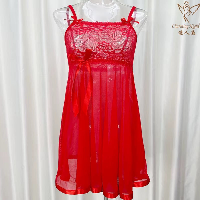 A red sheer lace babydoll lingerie chemise dress displayed on a clear mannequin torso against a white curtain backdrop. The chemise features a floral lace bodice, thin shoulder straps with bow details, a matching red satin bow at the waist, and a flowing sheer skirt.