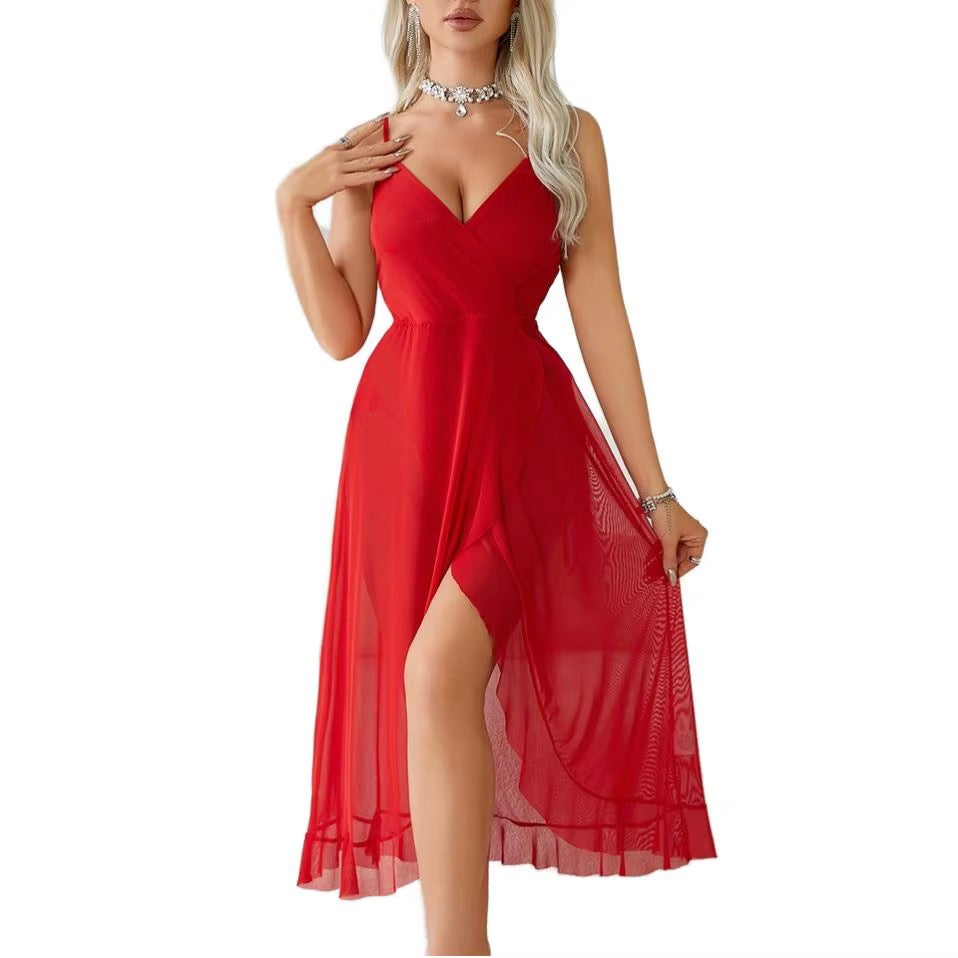 A woman modeling a sleeveless red midi dress with a V-neckline, high slit, and flowing sheer skirt against a plain white background.