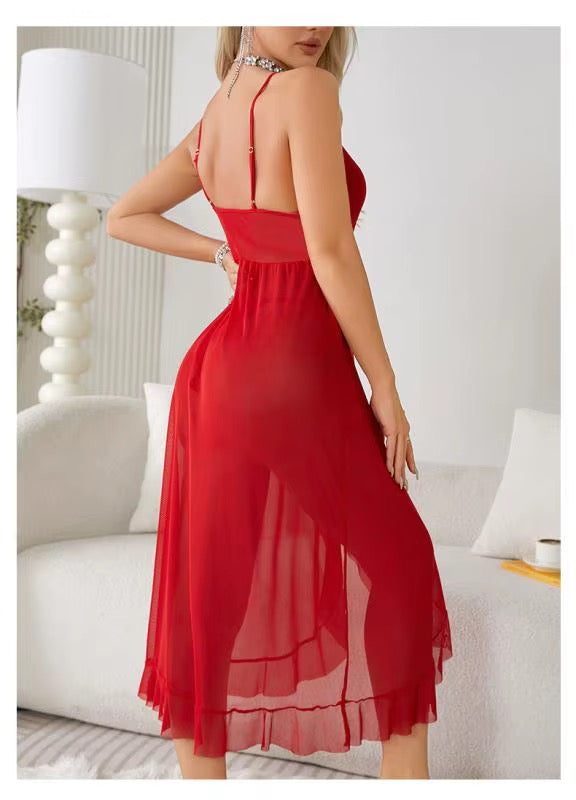 Red dress worn by a person in a room with white furniture and decor.