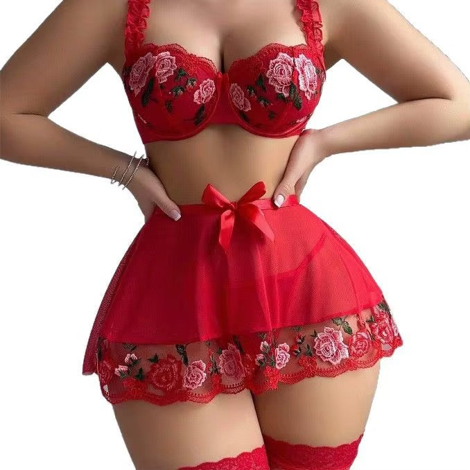 Red lingerie set with floral embroidery on a white background