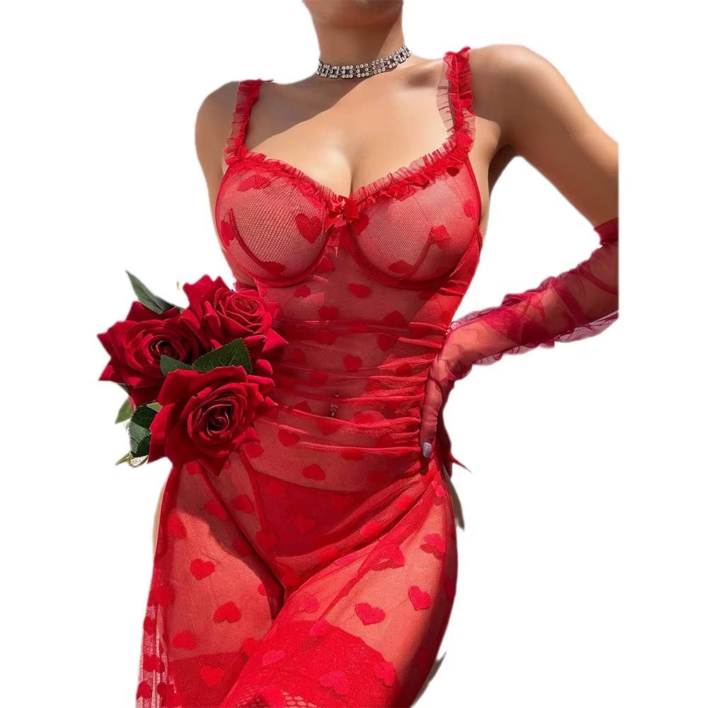 Red lingerie set with heart patterns and a bouquet of red roses on a white background