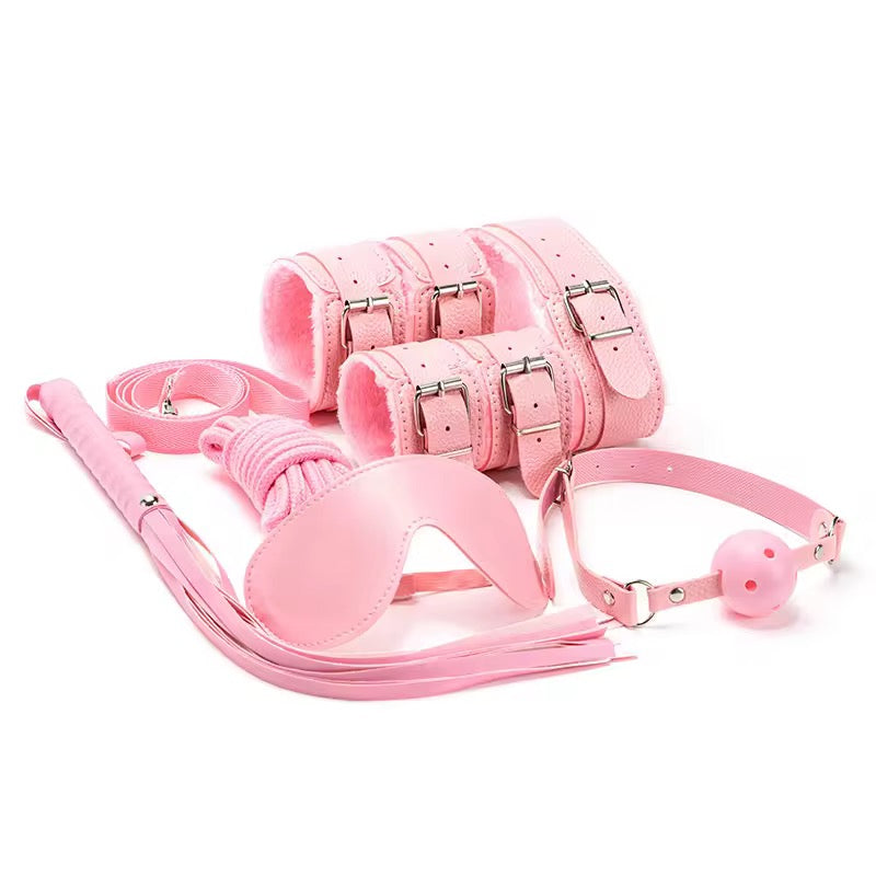 Pink leather restraint set on a white background