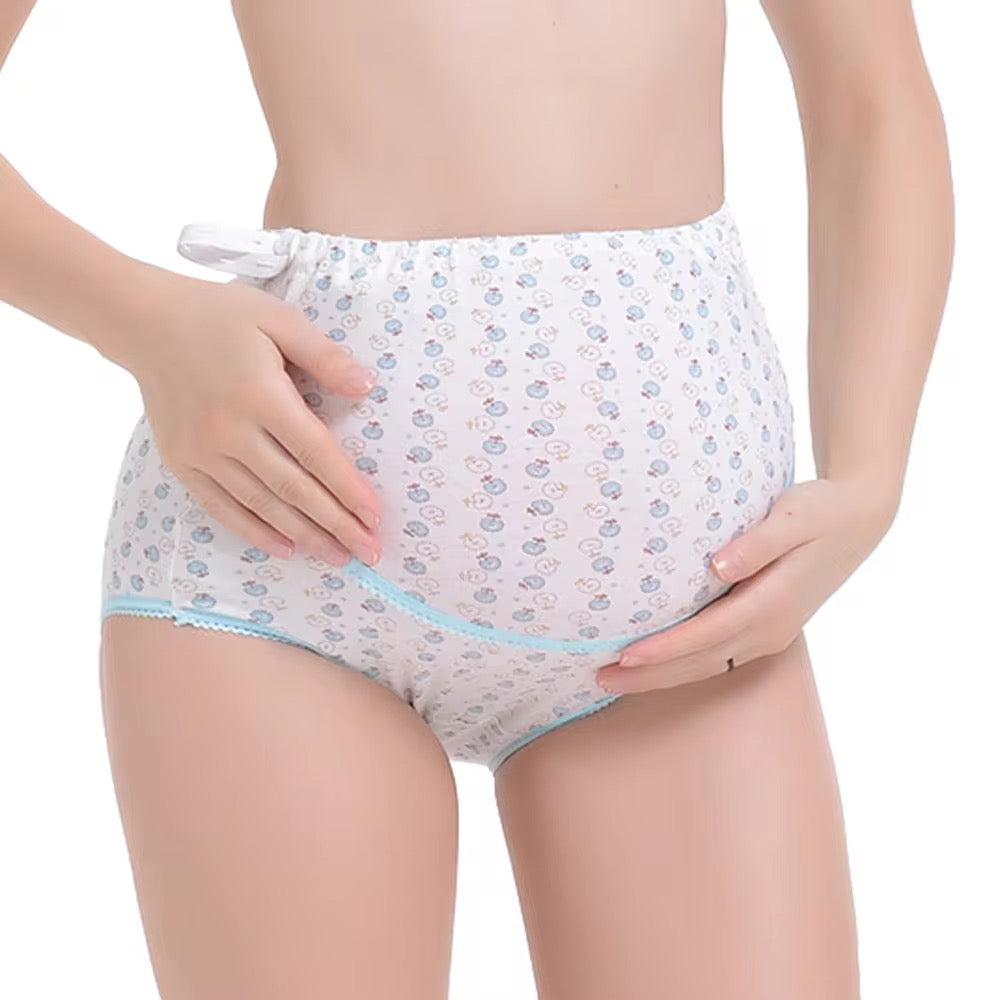 White underwear with blue floral pattern worn by a person on a white background