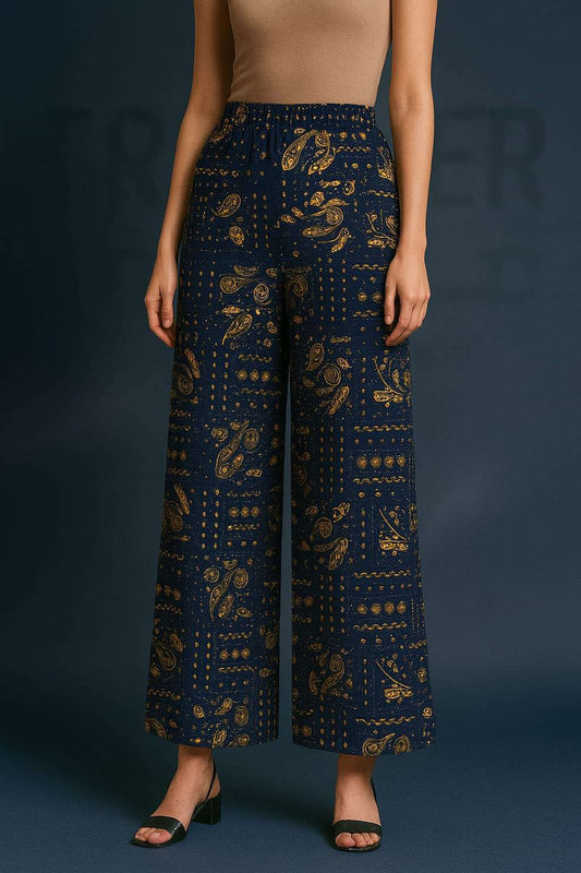 Navy blue patterned pants worn by a model on a dark background