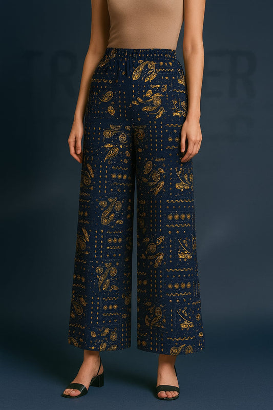 Navy blue patterned pants worn by a model on a dark background
