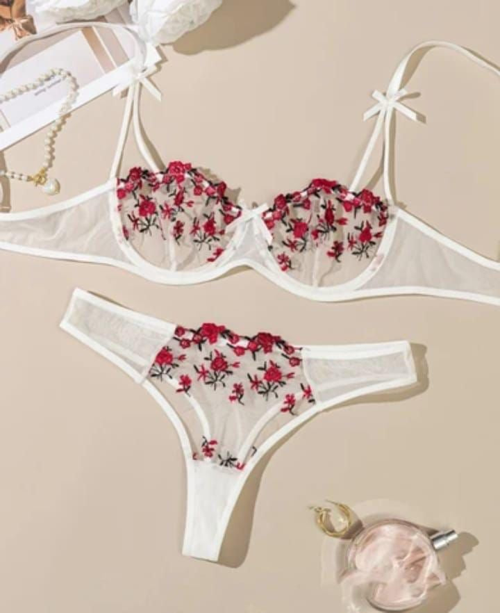 Floral embroidered lingerie set on a beige background